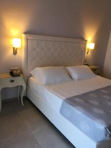 Letto o letti in una camera di Hotel Puglia Garden