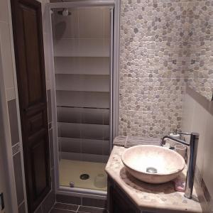 a bathroom with a sink and a shower at GAUDISSARD A619 in Barcelonnette