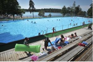 a group of people in a large swimming pool at Poroholman Lomakeskus in Rauma