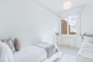 A bed or beds in a room at Luminoso Appartamento con Terrazzo Vicino all'Universita'
