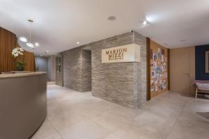 a lobby of a hospital with a stone wall at Maritim Antonine Hotel & Spa in Mellieħa