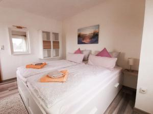 Кровать или кровати в номере Pension Nele Hohaus
