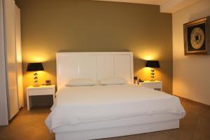 Posteľ alebo postele v izbe v ubytovaní Hotel Cariatis