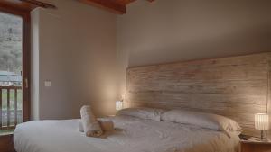 A bed or beds in a room at Saplan Real Estate PORTET