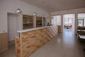 a tasting room with a bar in a building at Elka Hills Hotel in Sukko