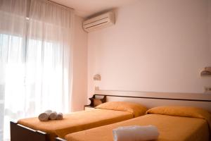 Postel nebo postele na pokoji v ubytování Hotel Zeus