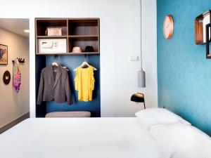 Postel nebo postele na pokoji v ubytování Hôtel ibis Styles Clermont-Ferrand Gare