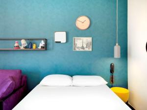 Postel nebo postele na pokoji v ubytování Hôtel ibis Styles Clermont-Ferrand Gare