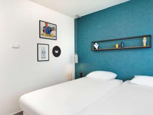 Postel nebo postele na pokoji v ubytování Hôtel ibis Styles Clermont-Ferrand Gare