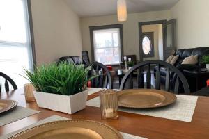 a dining room table with chairs and a dining room at The Casino Cottage-5br 2bath minutes from the Falls & Casino in Niagara Falls