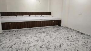 Postel nebo postele na pokoji v ubytování Rajlakshmi Guest House