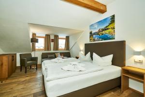 Postel nebo postele na pokoji v ubytování Hotel Rupertihof