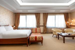 Cama ou camas em um quarto em Occidental Taksim