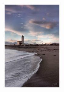 
a lighthouse on a beach with a sky background at Hotel Blanca Brisa Cabo de Gata in El Cabo de Gata
