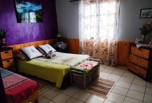 Ein Bett oder Betten in einem Zimmer der Unterkunft La Caz Oceane