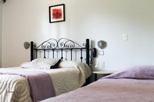 Voodi või voodid majutusasutuse Hotel Sienna toas