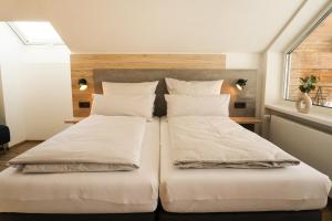 Postel nebo postele na pokoji v ubytování Hotel verWeiler