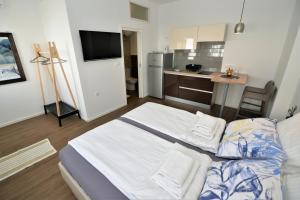 Posteľ alebo postele v izbe v ubytovaní EnVi Apartments