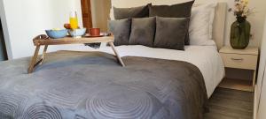 a bedroom with a bed with a table on it at Apartment City Center in Rovinj