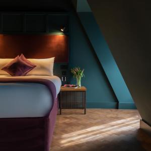 A bed or beds in a room at Duke Street Boutique Hotel