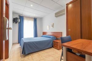 Postel nebo postele na pokoji v ubytování Hotel Reig