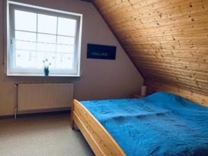 Ein Bett oder Betten in einem Zimmer der Unterkunft 50059 Ferienhaus
