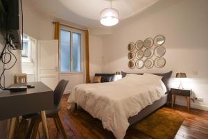 Ένα ή περισσότερα κρεβάτια σε δωμάτιο στο Large Flat At 2 Steps From The Eiffel Tower