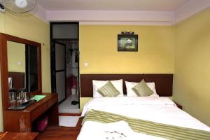 Ein Bett oder Betten in einem Zimmer der Unterkunft New Hotel Panda