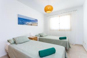 Posteľ alebo postele v izbe v ubytovaní SEA PEARL Holiday Home by Sunkeyrents + 23 fotografií