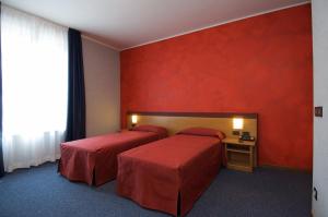 Tempat tidur dalam kamar di Hotel Residence Ducale