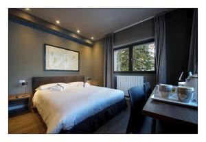 A bed or beds in a room at Il Rifugio del Risol