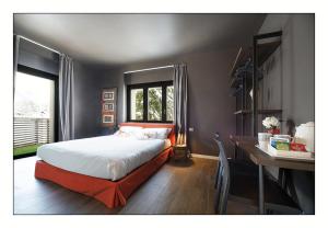 A bed or beds in a room at Il Rifugio del Risol