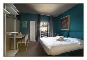 A bed or beds in a room at Il Rifugio del Risol