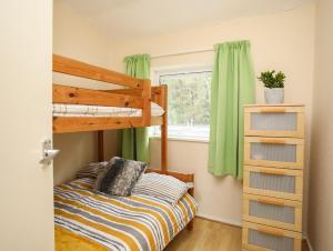 a bedroom with a bunk bed and a window at Eirlys in Caernarfon