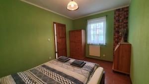 En eller flere senge i et værelse på Penzion Na Lednické