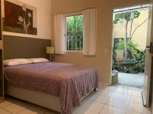 Cama ou camas em um quarto em Villa Paraíso