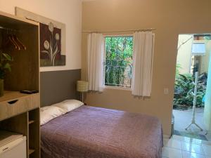 Cama ou camas em um quarto em Villa Paraíso
