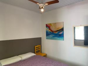 Cama ou camas em um quarto em Villa Paraíso