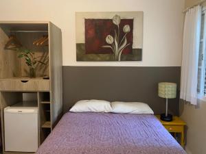 Cama ou camas em um quarto em Villa Paraíso
