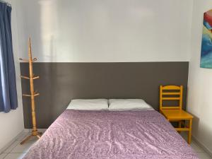 Cama ou camas em um quarto em Villa Paraíso