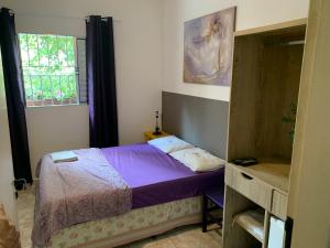 Cama ou camas em um quarto em Villa Paraíso