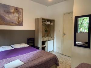 Cama ou camas em um quarto em Villa Paraíso