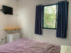 Cama ou camas em um quarto em Villa Paraíso