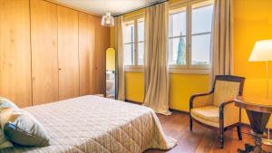 Posteľ alebo postele v izbe v ubytovaní CASA DEL VENTO 10, Emma Villas