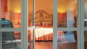 Posteľ alebo postele v izbe v ubytovaní CASA DEL VENTO 10, Emma Villas