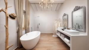 a white bathroom with two sinks and a large tub at Cinque Cipressi 8, Emma Villas in Montecatini Val di Cecina +39 photos