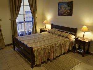 Un pat sau paturi într-o cameră la MURÇAS 74 - STUDIO APARTMENTS