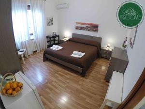 A bed or beds in a room at La Casetta