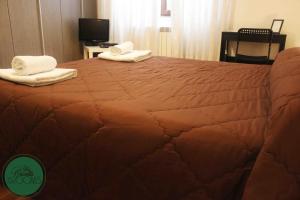 A bed or beds in a room at La Casetta