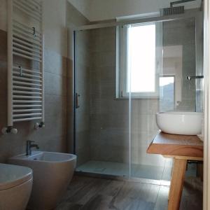 a bathroom with a tub and a sink and a shower at B&b Il Poggio Eccelso in Ogliastro Cilento +46 photos